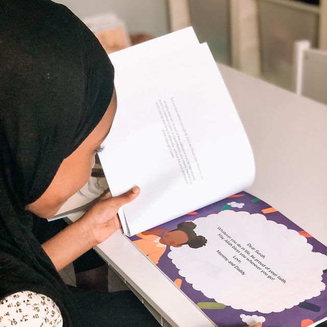 Child opens their Personalised Muslim Children's book by Proud Little Muslims about the Islamic Golden Age called Inventors of the Golden Age: Just like you!